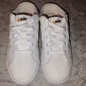 Nike women's Sz5, backless canvas white tennis shoe
